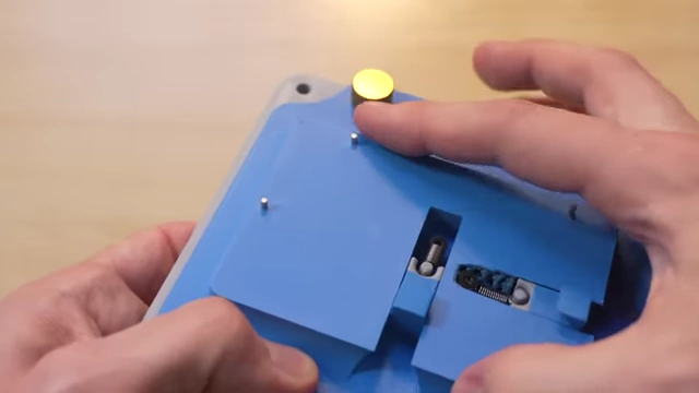 Custom two-plate alignment jig with PCB in place, showing dowel pins and spring-loaded cams