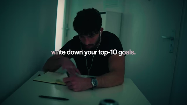 Speaker writing down his top 10 goals