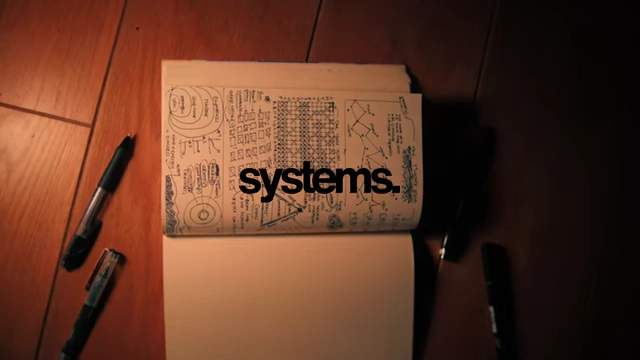 Detailed notebook entries outlining systems and progress tracking