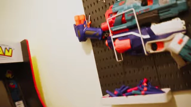 Nerf guns displayed on a wall for team activities