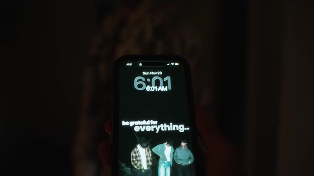 A phone screen displaying "6:01 AM"