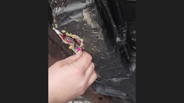 Severely rusted and poorly "repaired" vehicle frame.