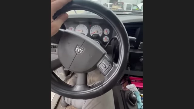 A mechanic demonstrating the extremely sensitive steering wheel movement.