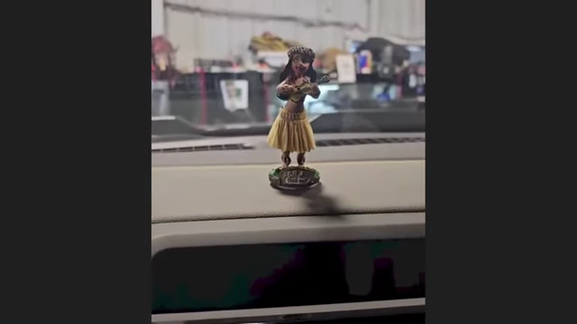 A hula girl bobblehead used to "diagnose" a misfire by its vibration.