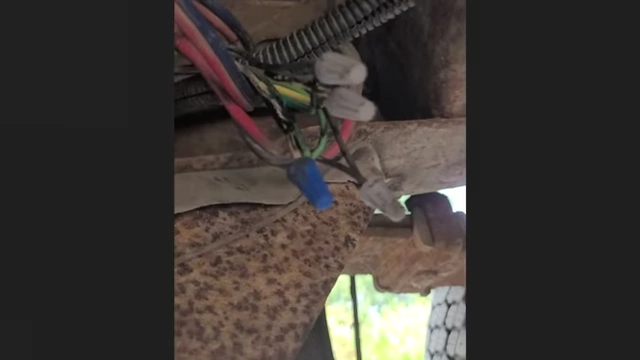 Poorly taped electrical connections, indicating a DIY wiring job.