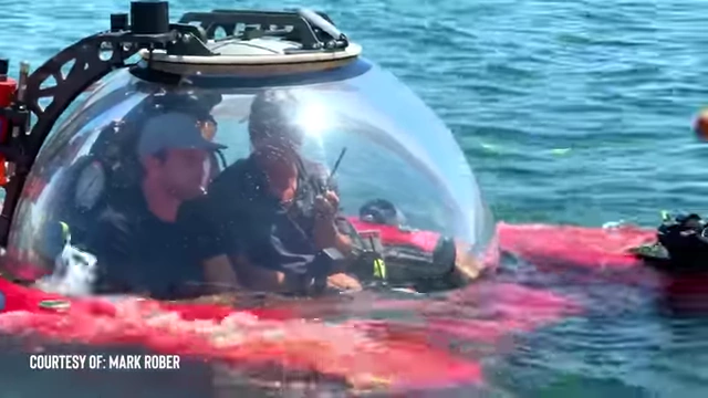 Mark Rober filming with an underwater vehicle