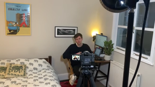 A former team member, Tintin, filming for his YouTube channel