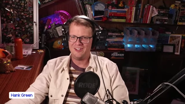 Hank Green, a prominent YouTuber and science communicator, speaking into a microphone during a virtual interview.