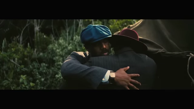Twin brothers Smoke and Stack share an embrace in a still from the film, symbolizing their bond.
