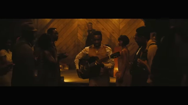 A vibrant scene from the juke joint in "Sinners," showcasing lively music and dancing as a cultural hub.
