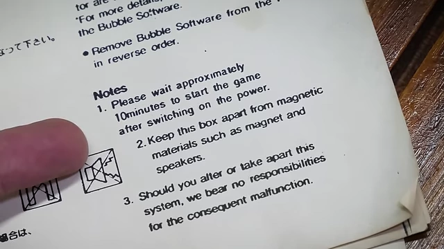 Manual indicating a 10-minute warm-up period is required for the Konami Bubble System.