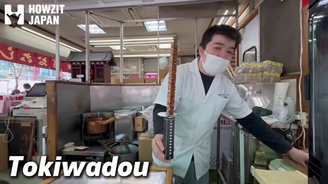 Shop worker holding the Katana Okoshi