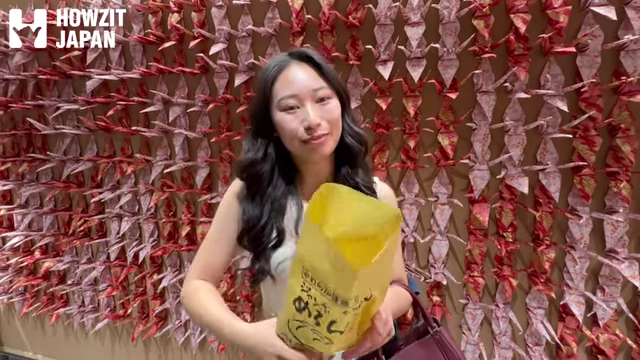 Speaker holding a hot, freshly baked Melon Pan