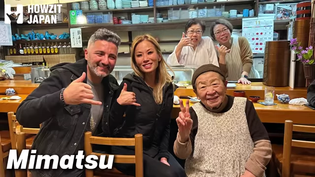 Mimatsu's family-run sushi restaurant staff with guests