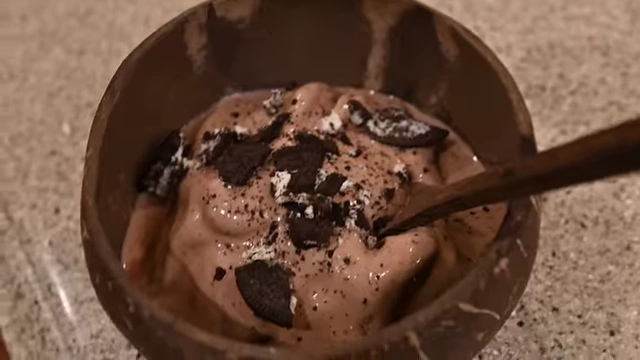 The final protein ice cream in a bowl, topped with crushed Oreos