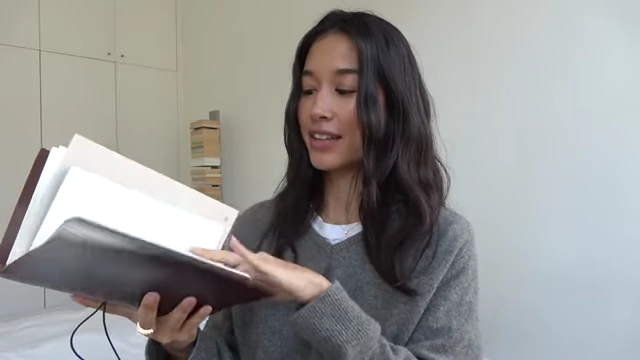 The Paper Republic Grand Voyageur leather portfolio, open to reveal multiple notebooks.