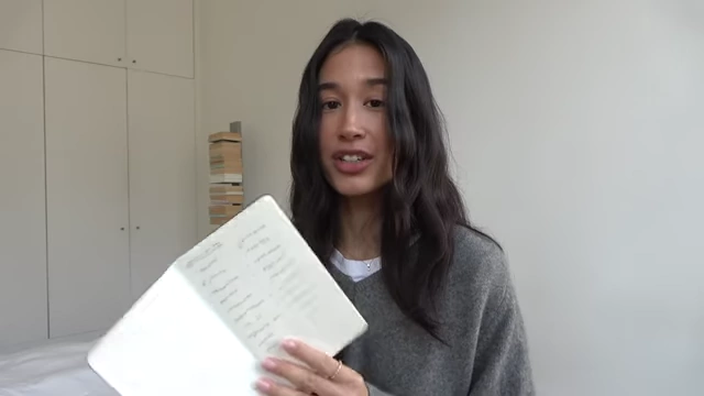 The presenter shows pages from her French exercise book, filled with handwritten notes.