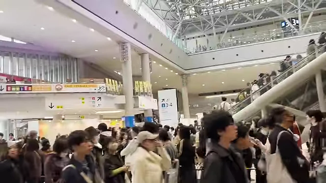 Attendees navigating the bustling entrance area of Design Festa.
