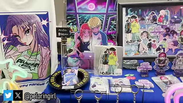 A booth showcasing colorful original character illustrations and merchandise.