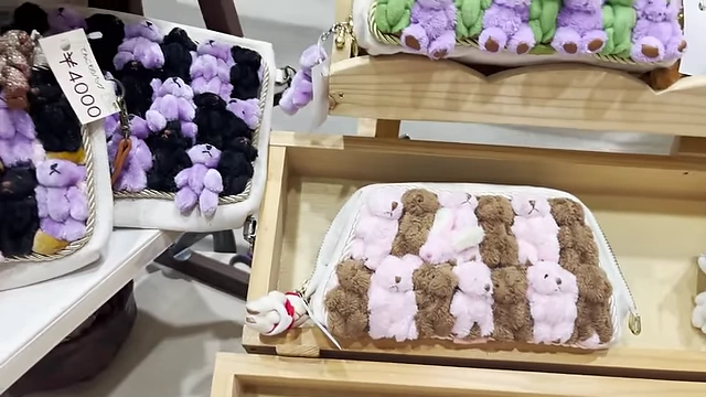 Handmade bags adorned with numerous small teddy bears, a unique niche product.