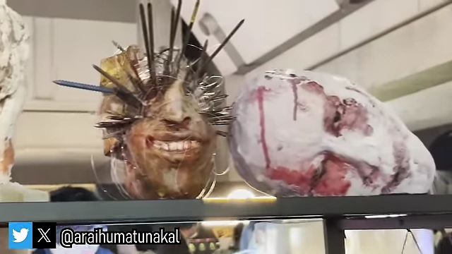 Genuinely terrifying, intricate handmade sculptures displayed in the low light section.