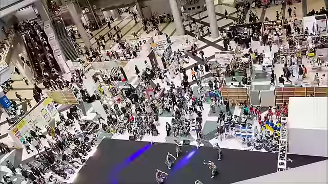 An aerial view of the main stage at Design Festa, featuring a dance performance.