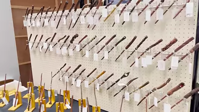 A unique booth displaying an extensive collection of handcrafted magical wands.