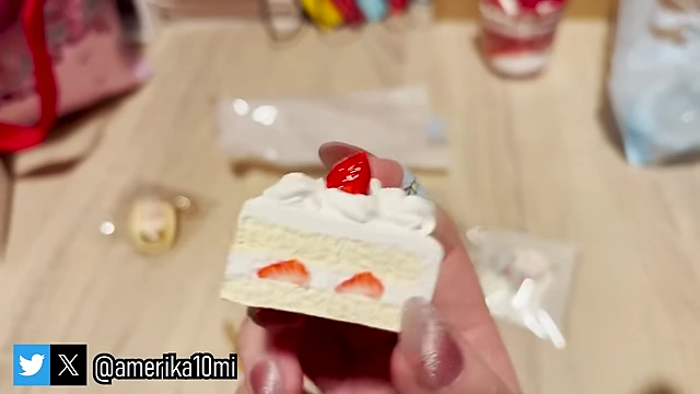 A detailed miniature strawberry shortcake keychain made of clay.