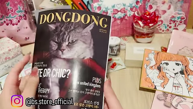 A freebie notebook designed to resemble a fashion magazine, featuring the cat Dongdong.