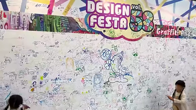 A community graffiti wall where attendees could freely draw and express themselves.