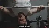Man Lifting Weights in a Gym