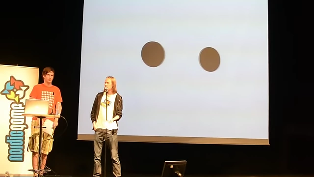 Two brown circles appearing to bounce off each other, with sound enhancing the perceived interaction.