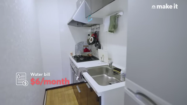 Lexi's compact kitchen, showing her $6/month water bill.