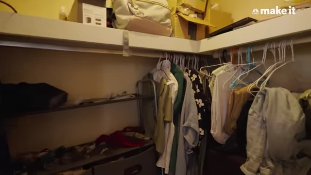 Lexi's walk-in closet storing clothes and travel bags.