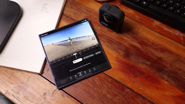 GoPro Max 2 next to a smartphone displaying the Quik app editing interface