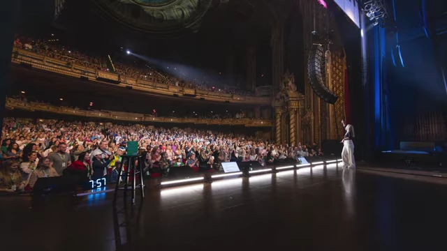 Mel Robbins on stage during her 'Let Them' tour, connecting with her audience in person