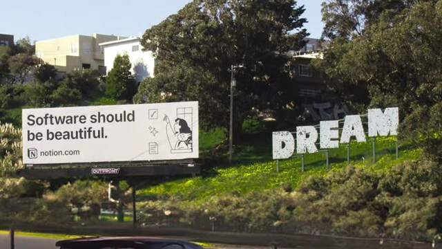 A Notion billboard stating, "Software should be beautiful," encapsulating the company's design philosophy.