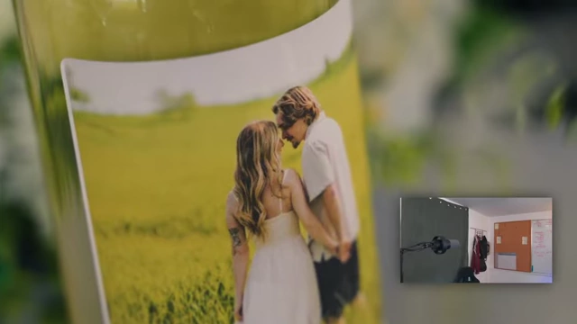 A wine bottle with a personalized label featuring a picture of the couple and the wedding date.