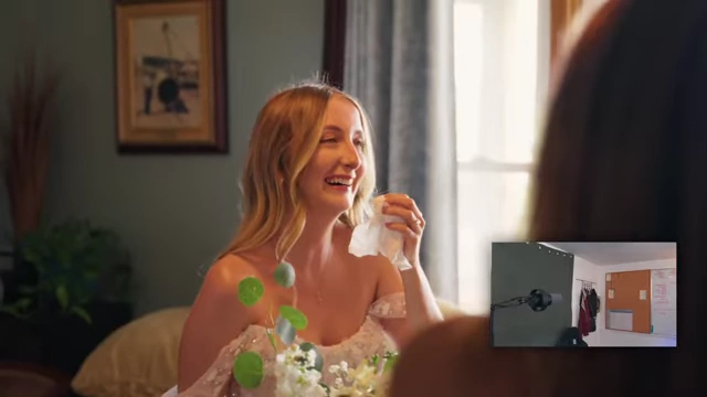 The bride sheds tears while holding a tissue, looking emotional.