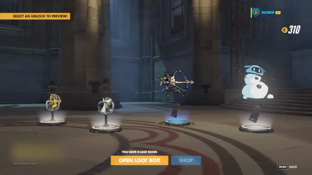 The Overwatch loot box interface, showing multiple unopened boxes and various rewards.