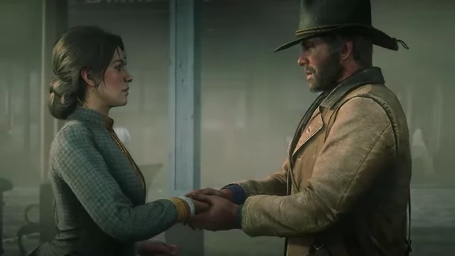 A tender moment between Arthur Morgan and a woman in a cinematic from Red Dead Redemption 2.