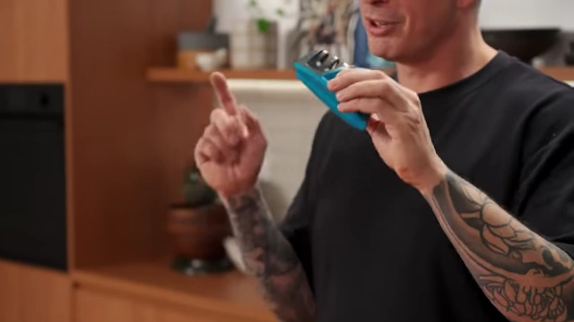 A small, blue pull-through knife sharpener