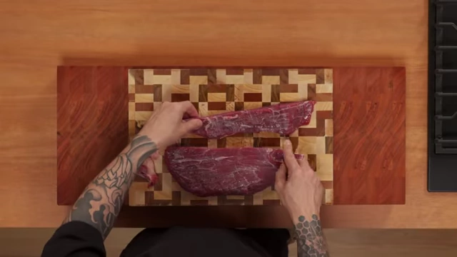 An overhead shot of a flank steak, highlighting the long muscle fibers that define the grain