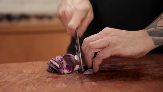 Thinly sliced red onion pieces, ready for use