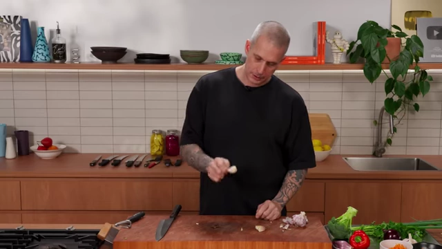 A smashed garlic clove with its skin easily removed