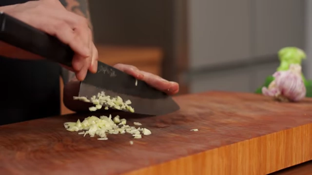 Finely minced garlic on a cutting board