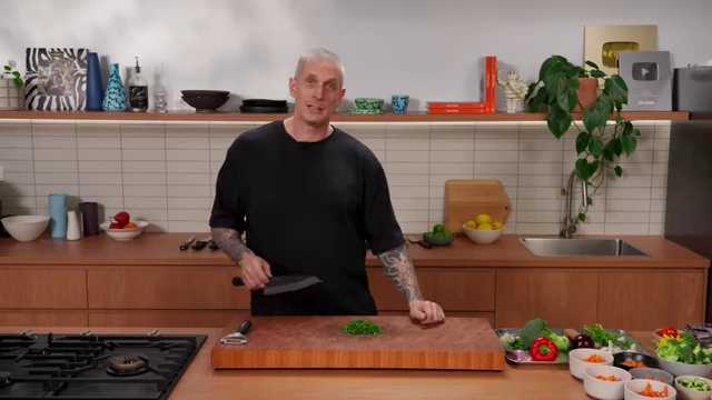 Finely chopped parsley on a wooden cutting board
