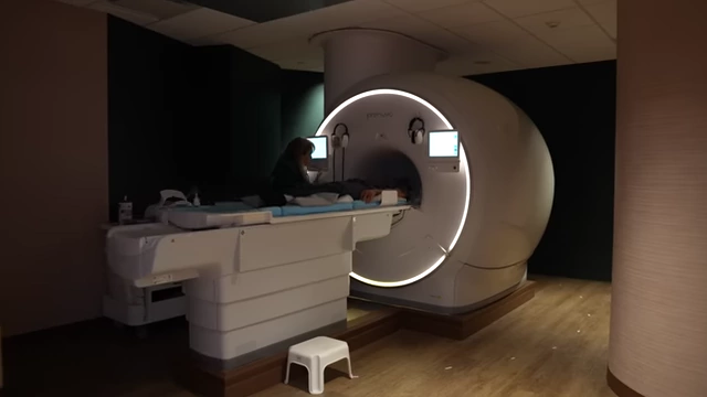 An MRI machine used to capture precise 3D images of muscles, serving as the gold standard for measurement.