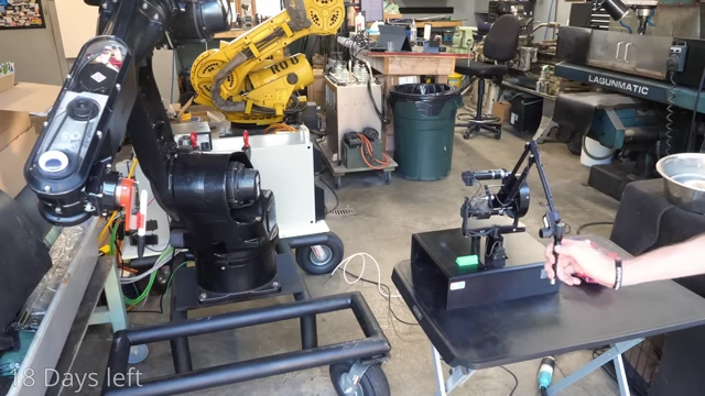 The robot arm precisely manipulating a colorful foam block using intuitive control
