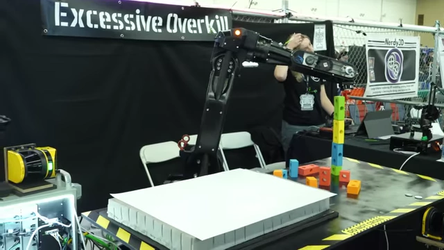 The completed industrial robot setup at the Open Sauce event with people interacting